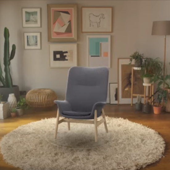 A chair can be seen in a living room setting using AR